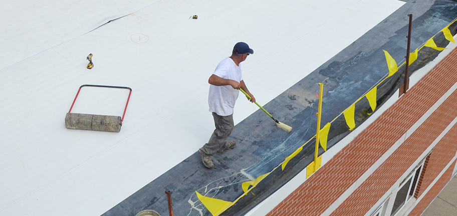 Man Waterproofing Roof